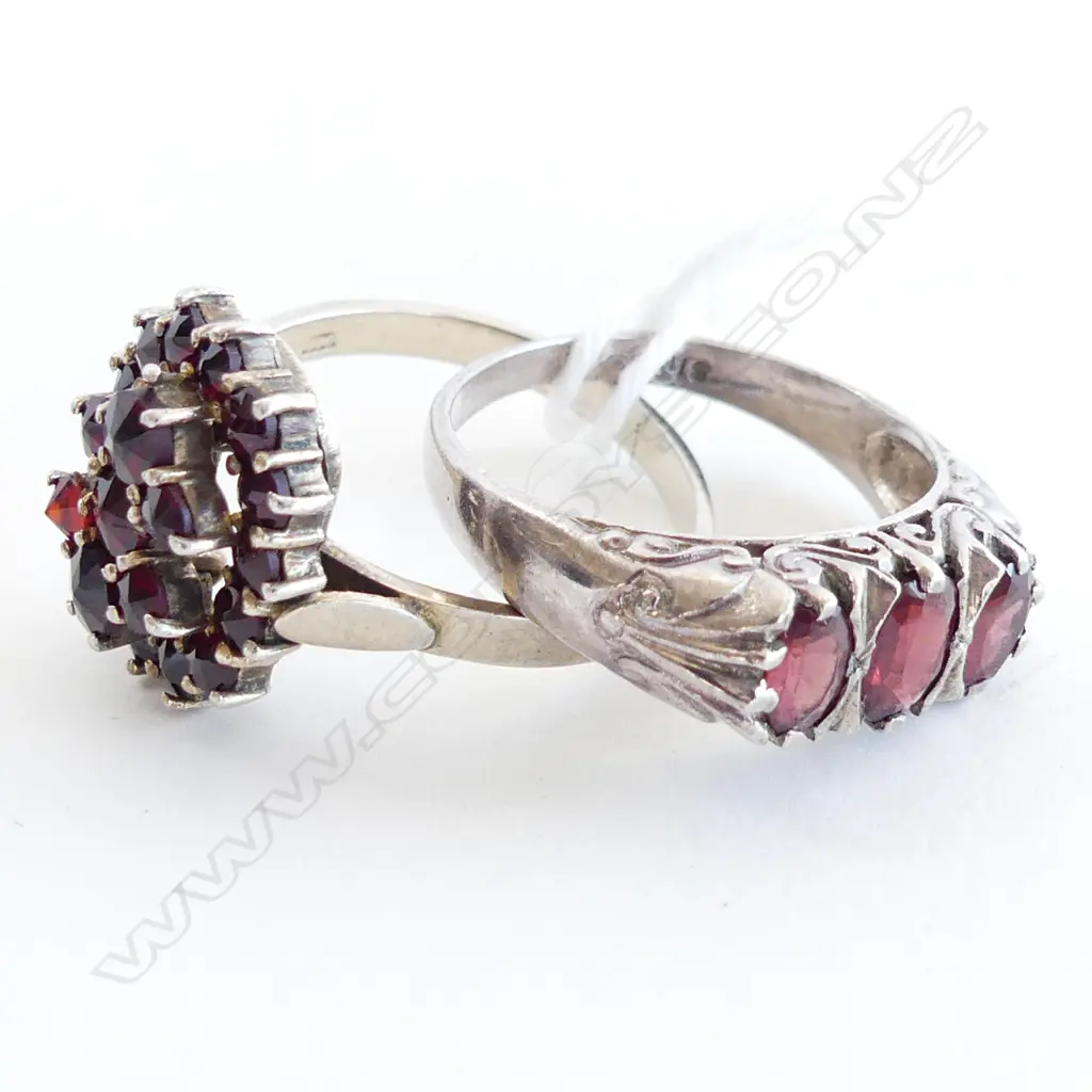 2 STG SILVER DRESS RINGS, ONE WITH GARNETS  & ONE  WITH 3 GARNET BAND Image 1++