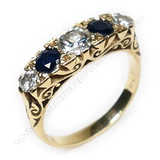 An 18ct gold estate diamond and sapphire ring,