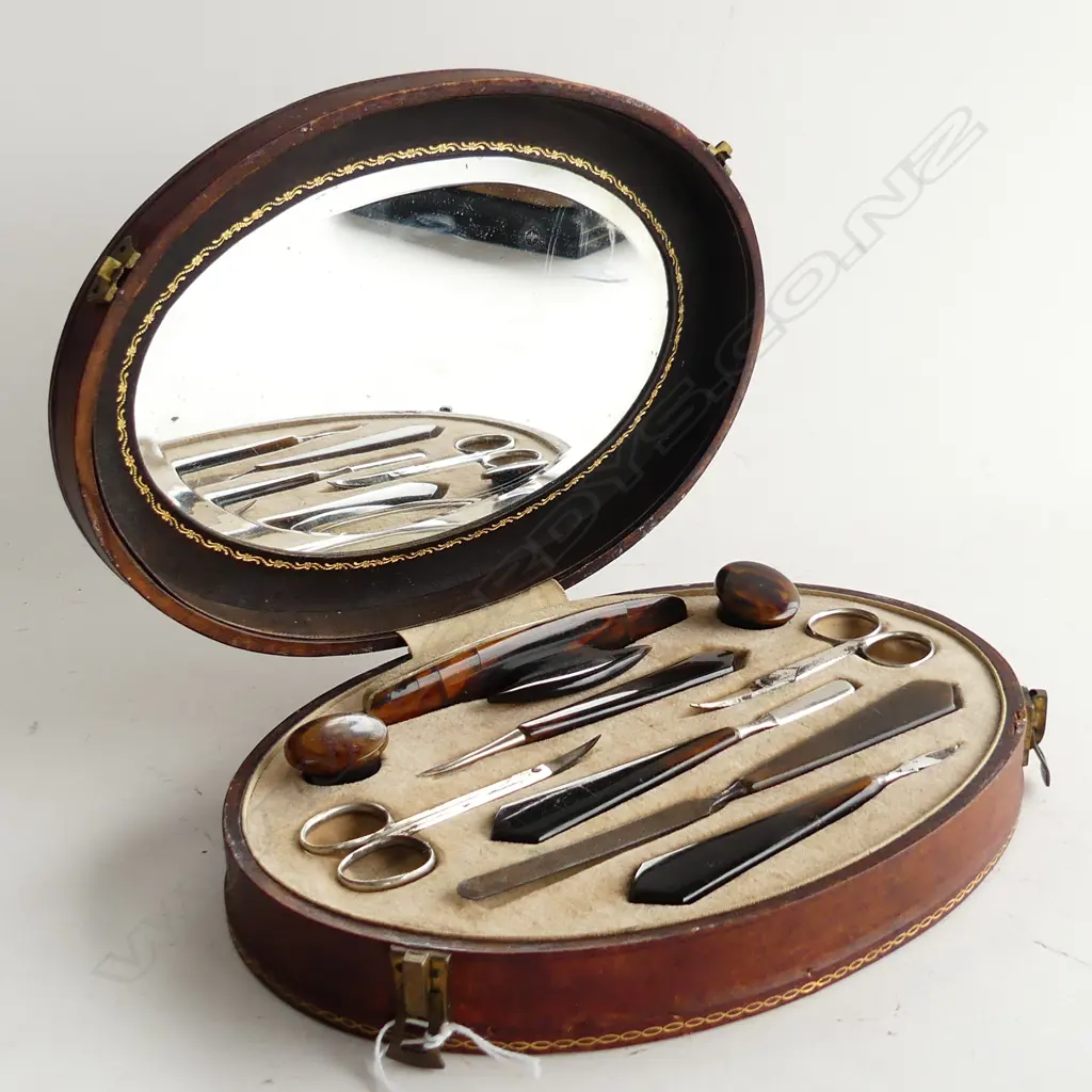 VINTAGE TORTOISESHELL MANICURE SET IN OVAL LEATHER CASE c.1920 W.250mm Image 1++