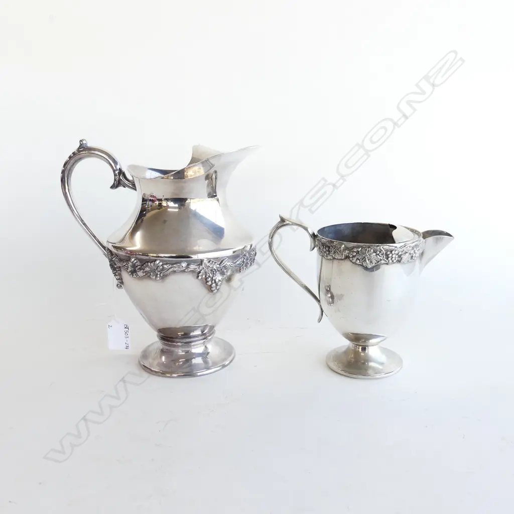 TWO SILVER PLATED WATER JUGS WITH GRAPE & VINE DECORATION H. 220MM & 135MM Image 1++