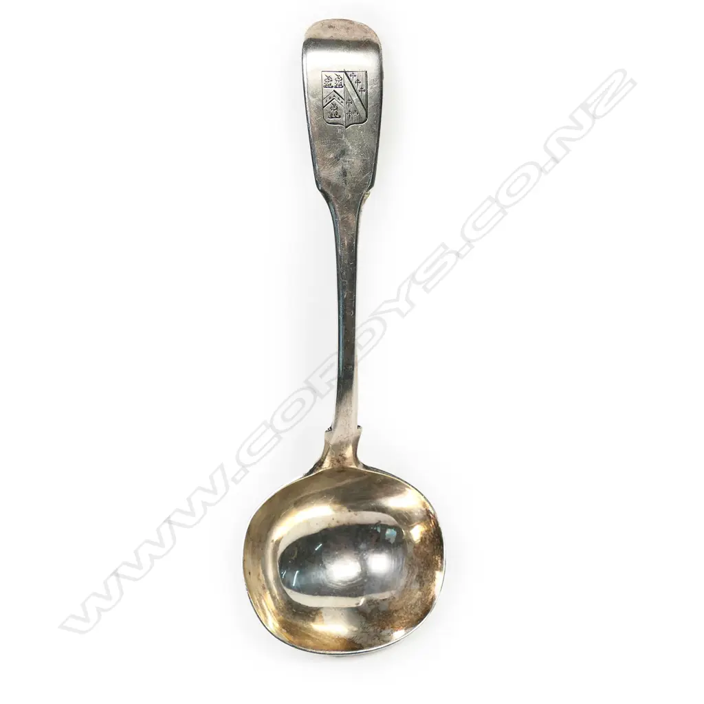 A William IV silver sauce ladle fiddle pattern with crested grip featuring three demi-unicorns. London 1835 by John Harris. L.180mm. 60gm. Image 1++