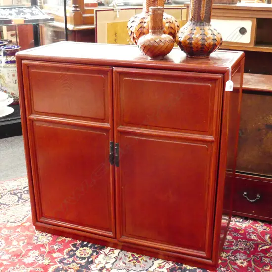 OLD JAPANESE CABINET. Red lacquered. w 2 panelled doors. 810 x 845mm.
