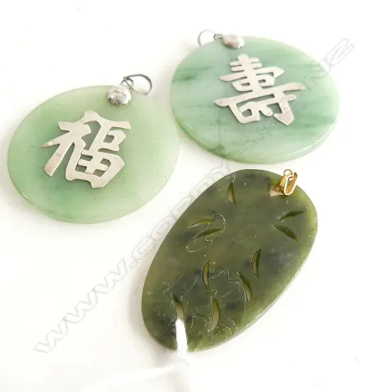 3 ORIENTAL DYED QUARTZ ? PENDANTS; 55 / 48mm dia + OVAL CARVED PHOENIX