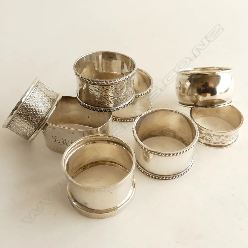 EIGHT ASSTD SILVER NAPKIN RINGS 188gm Image 1++