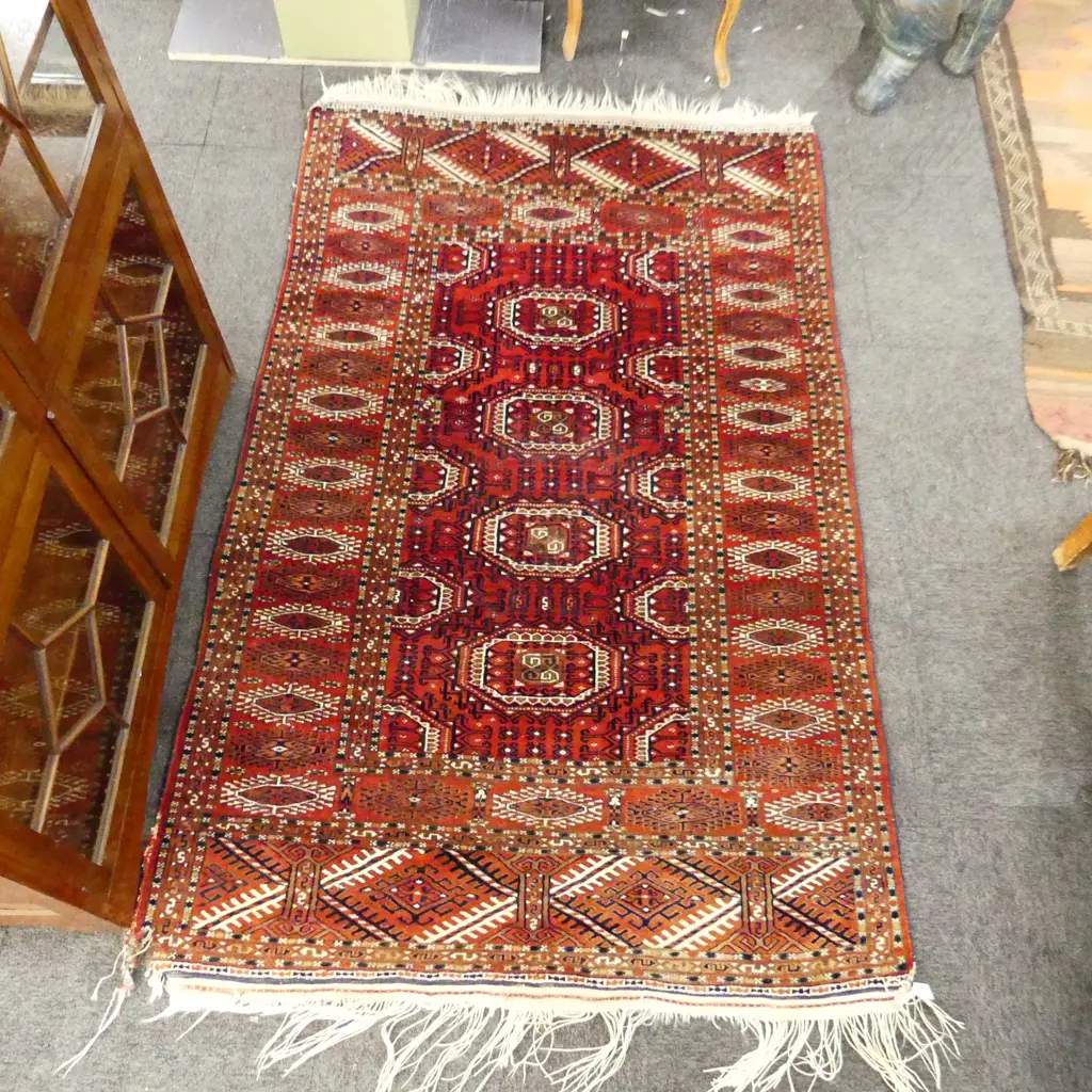 HAND KNOTTED TURKOMAN RUG WITH  DAMAGE TO ONE CORNER 1960 X 1200 MM Image 1++