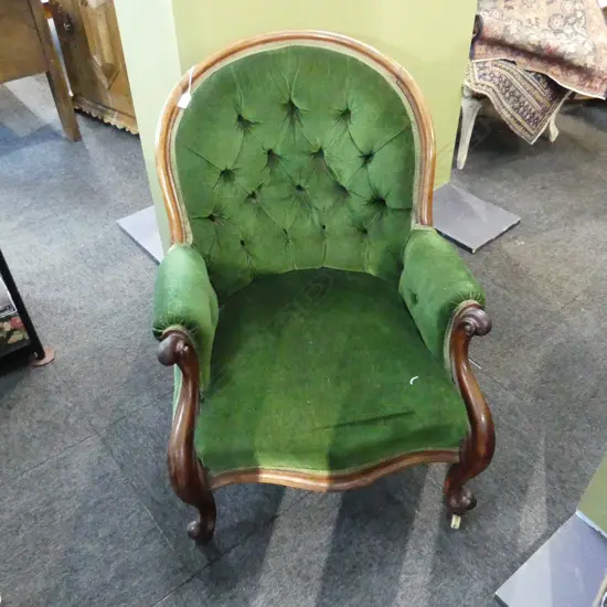 A  VICTORIAN MAHOGANY FRAMED ARMCHAIR