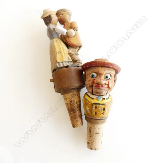 TWO ANRI MECHANICAL BOTTLE STOPPERS - DANCING KISSING COUPLE & MAN WITH ROLLING EYES & MOUTH L. 160 & 110MM