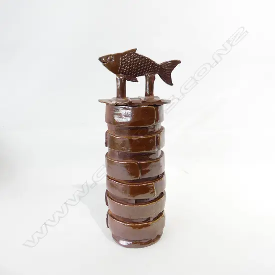 'MM' TALL SCULPTED CYLINDER VASE FISH TO LID strap construction. Incised MM mark H.390mm