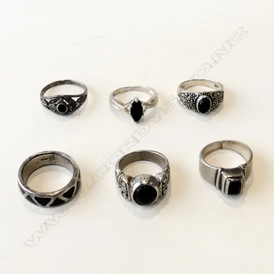 6 STG RINGS - BLACK STONES (1 UNMARKED) 22 GRAMS