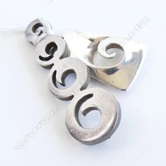 2 HEAVY CAST SILVER DESIGNER PENDANTS. KORU TYPE DESIGNS