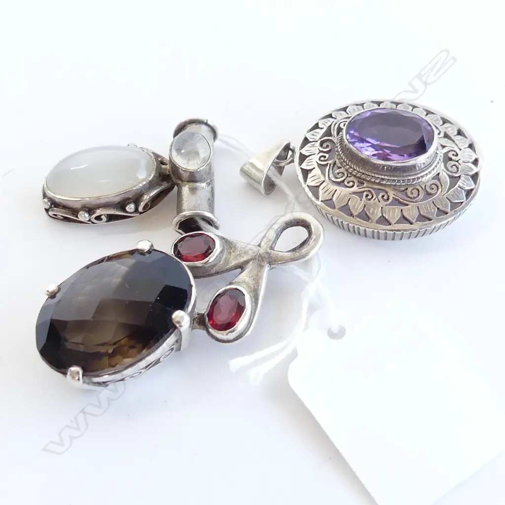 THREE SILVER AND GEMSTONE PENDANTS Image 1++