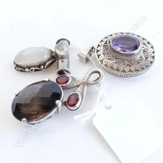 THREE SILVER AND GEMSTONE PENDANTS