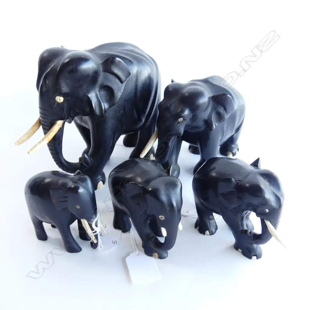 GROUP OF FIVE EBONY ELEPHANTS. GRADUATING FROM H.160mm DOWN TO 60mm . SOME TUSKS BROKEN OR MISSING Image 1++