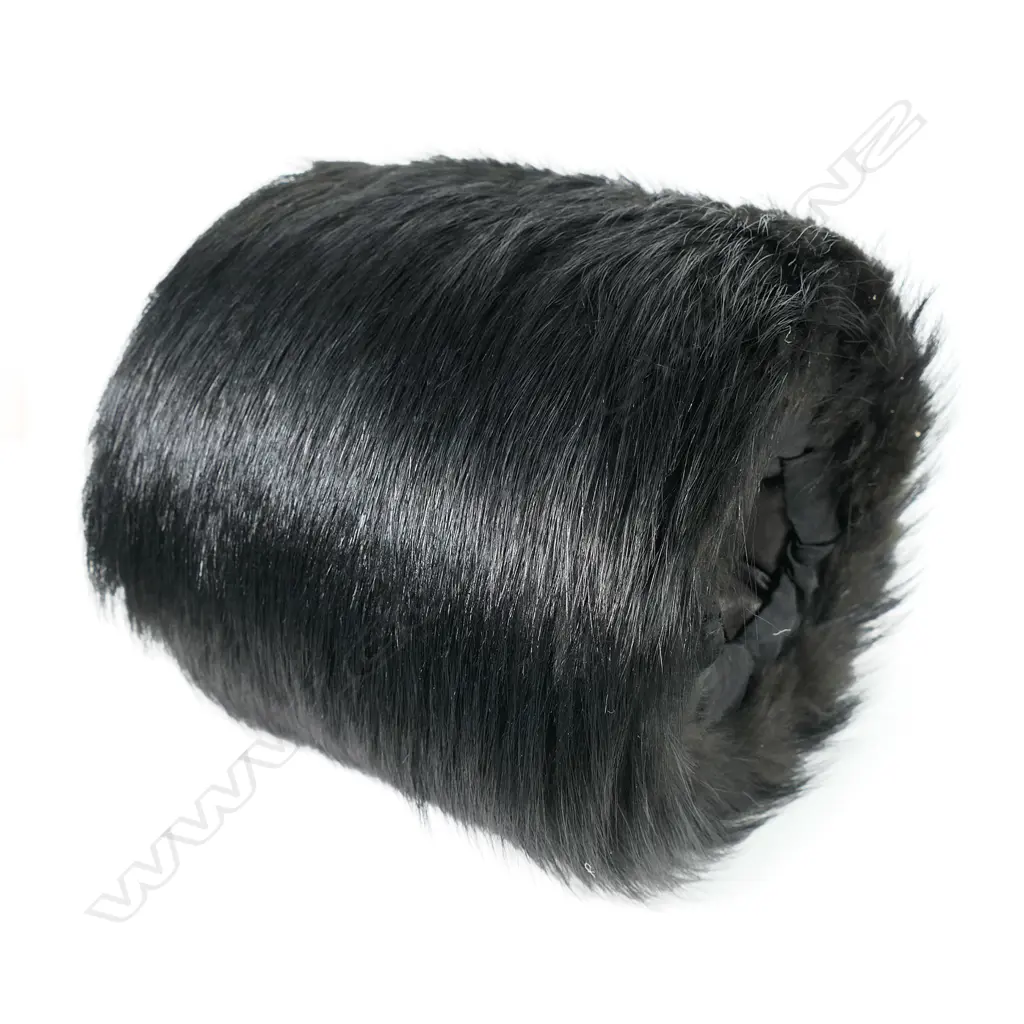 A 19thC French bearskin hand warming muff in original box. With retailer's address to the lid. Image 1++