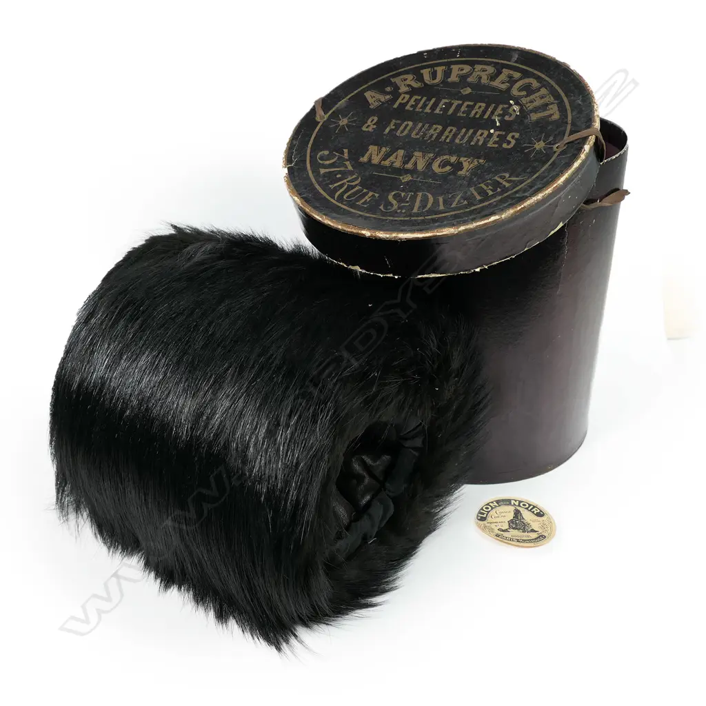 A 19thC French bearskin hand warming muff in original box. With retailer's address to the lid. Image 1++