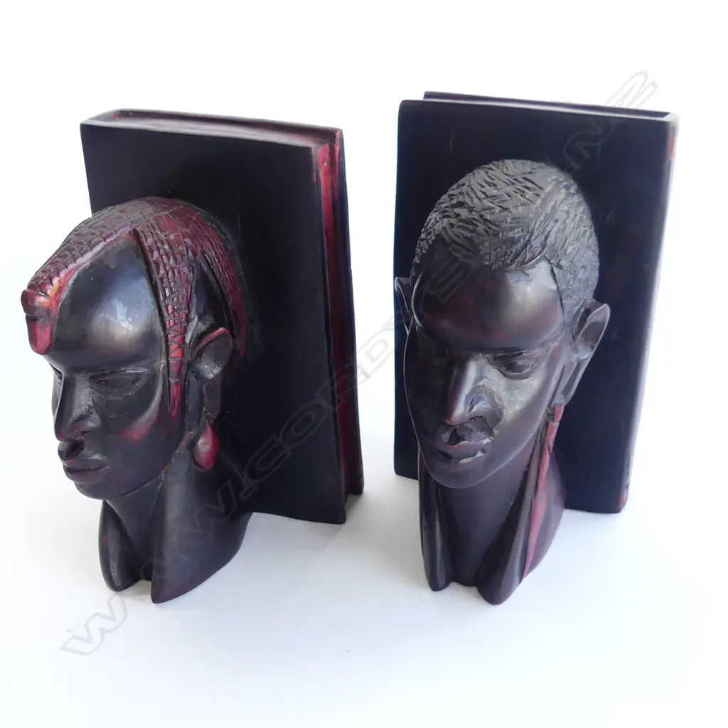 PAIR OF EBONY CARVED BOOKENDS WITH FAUX BOOK PART. AS MALE AFRICAN WARRIORS WITH RED ACCENTS. H.200mm RED ACCENTS  Image 1++