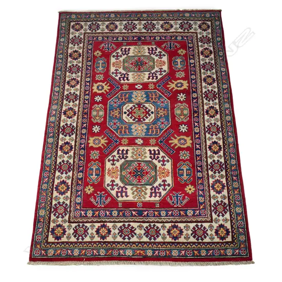 A tribal Kazak rug, hand knotted wool pile,