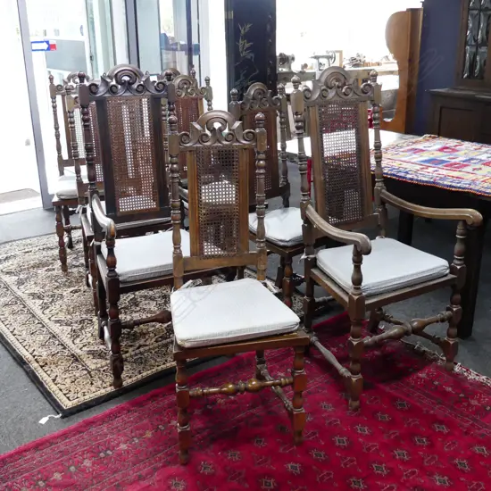8 JACOBEAN STYLE HIGH BACK DINING CHAIRS (2 ARE CARVERS) 