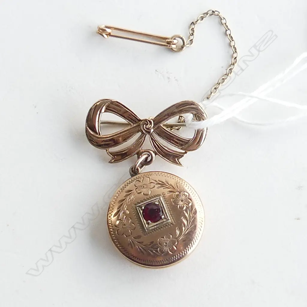 9CT ROSE GOLD LOCKET ON BOW BROOCH 8.1gms Image 1++