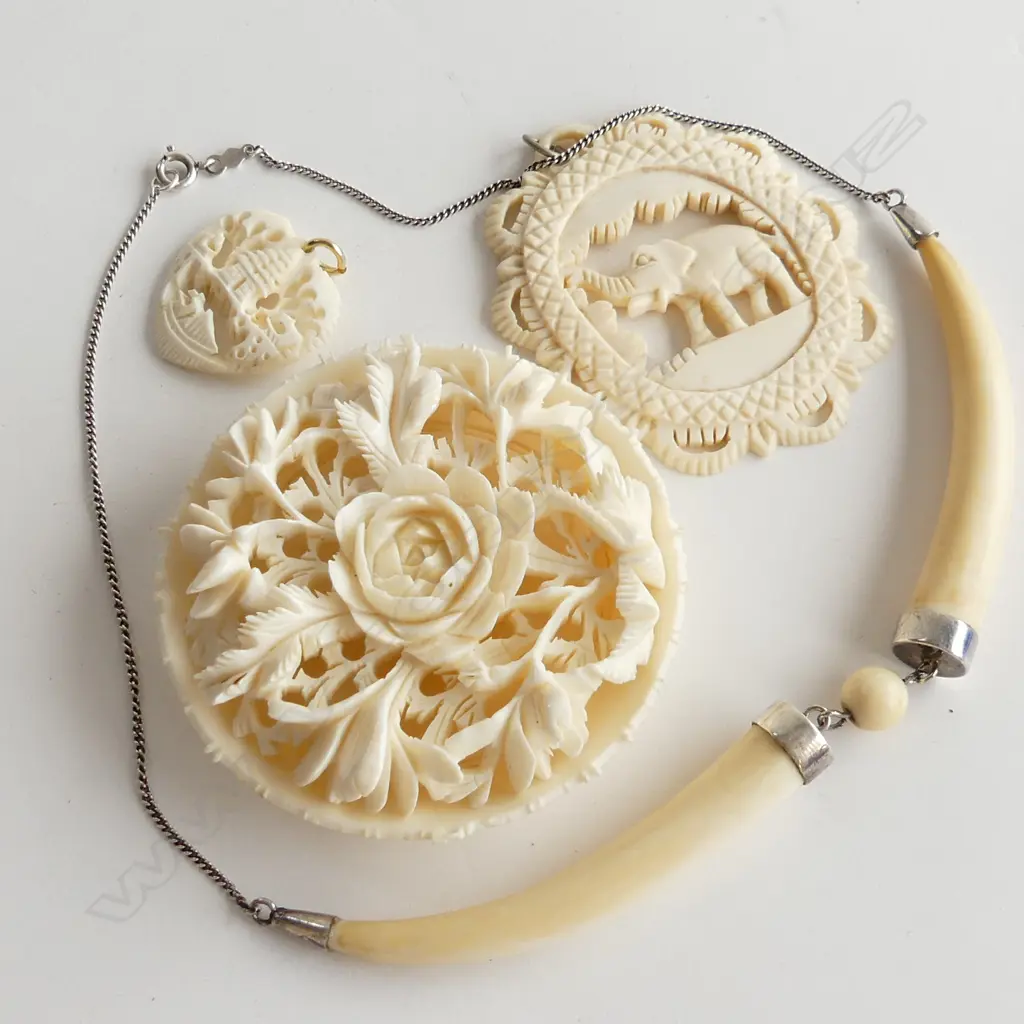 4 IVORY PCS; CARVED DECORATIVE ORNAMENT, 2 CARVED PENDANTS 1 WITH ELEPHANT & STG & TUSK SHAPED NECKLACE Image 1++