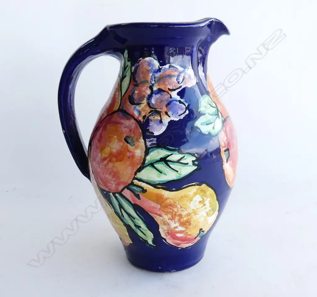 'ESTUARY ARTS GOLDEN BAY' FRUIT PAINTED JUG BLUE GROUND H.245mm Image 1++