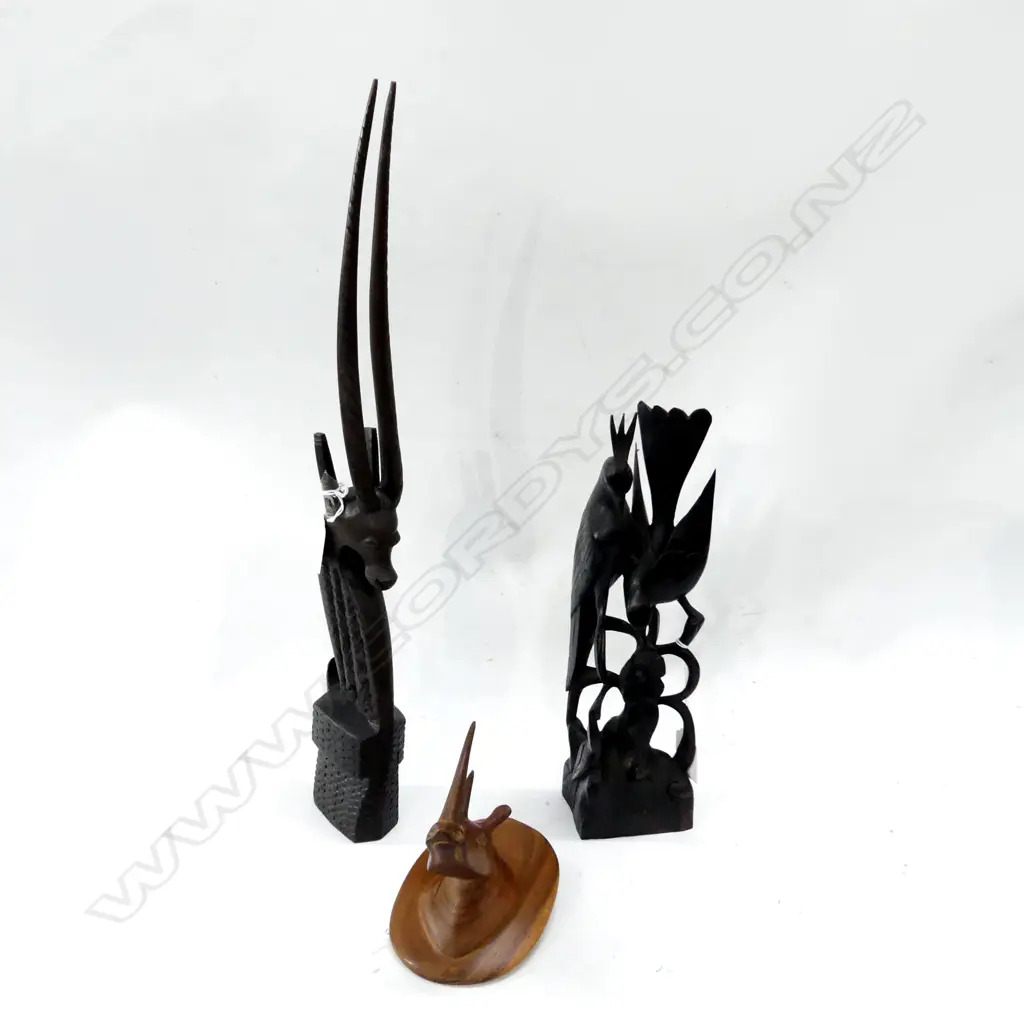 THREE CARVED ANIMALIA ITEMS. RHINO BUST H.120mm AFRICAN SCIMITAR ONYX H.470mm & TWO CARVED BIRDS ON A BRANCH H. 300mm Image 1++