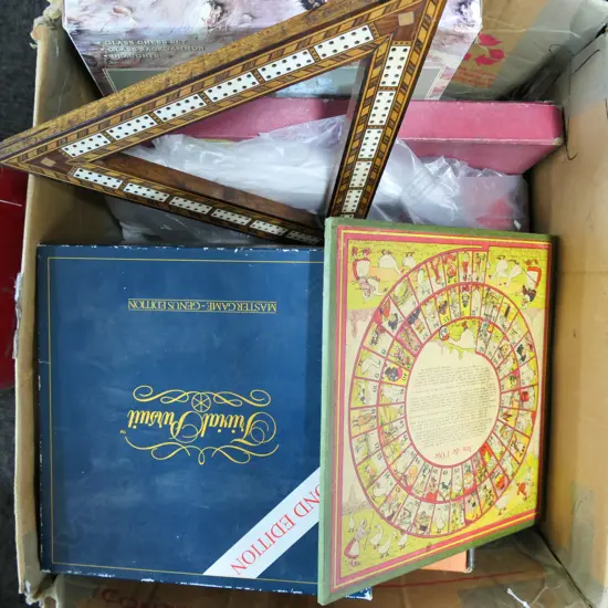 BOX OF BOARD & OTHER GAMES & TOYS. Ebony draughts set. Trivial Pursuits. antique inlaid cribbage board. Olympic games.. 