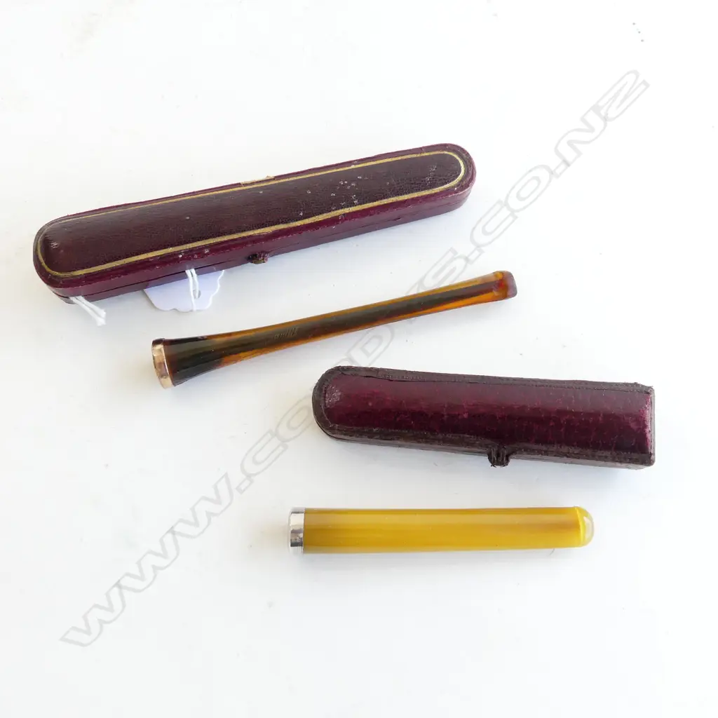 TWO ANTIQUE CIGARETTE HOLDERS W. CASES LABELED “COMOY’S FINEST AMBER LONDON MADE” & “STERLING SILVER MTD” L. 125MM & 90M Image 1++