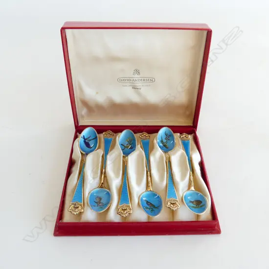 BOX OF NORWEGIAN SILVER GILT AND ENAMEL SPOONS (NZ BIRDS)