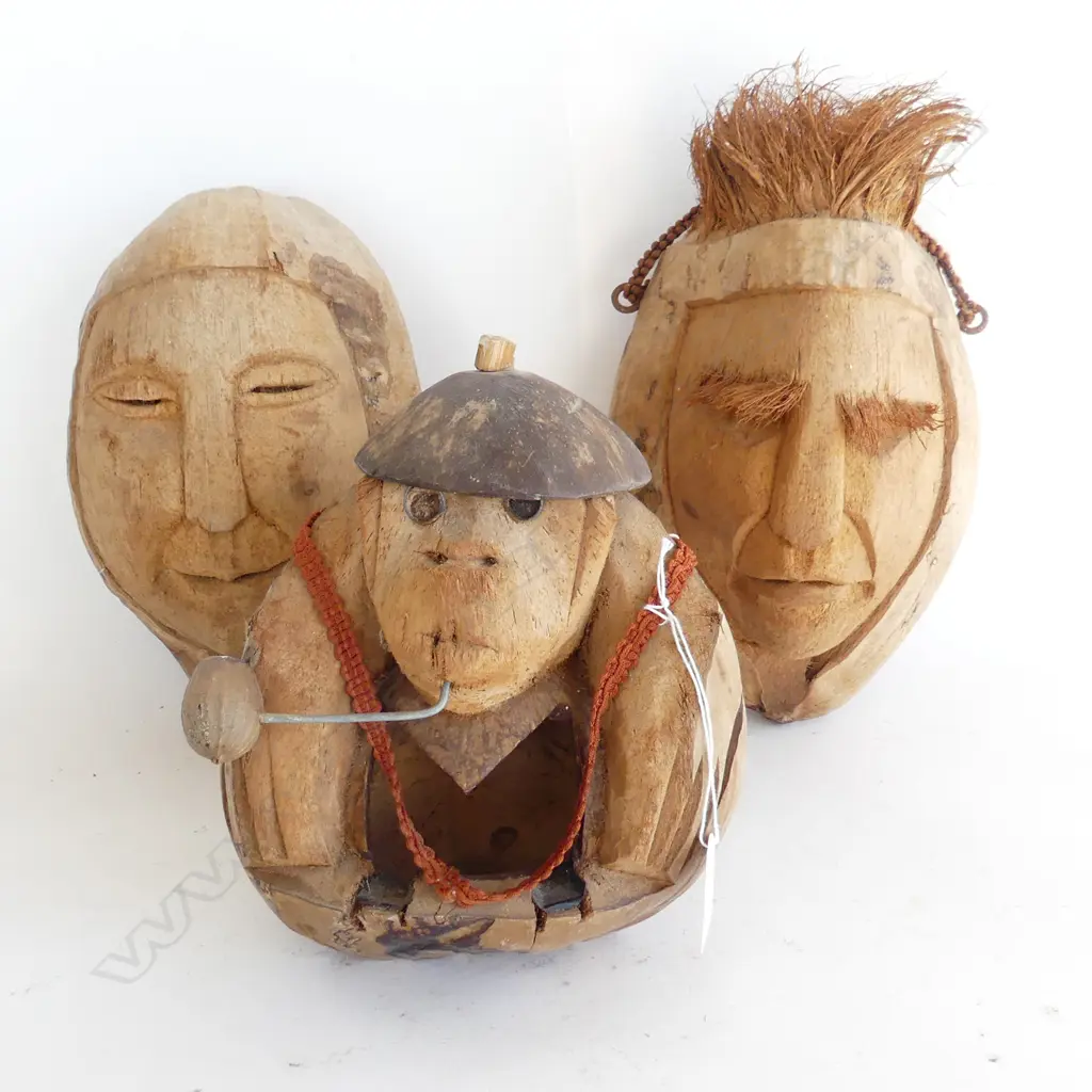 3 PACIFIC ISLAND FOLK ART CARVED COCONUTS, 2 FACE WALL MASKS & ONE MONKEY WITH PIPE  Image 1++
