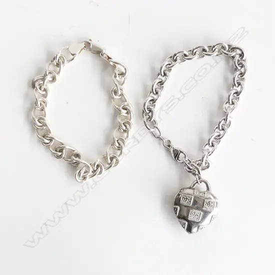  2 STERLING SILVER CURB LINK BRACELETS 50GMS.