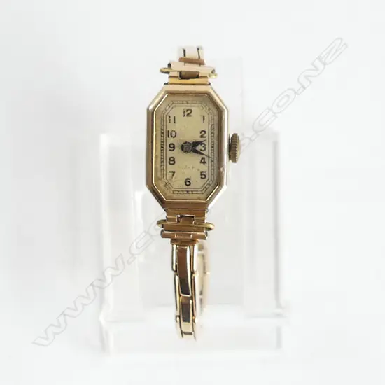  9CT GOLD CASED LADIES WATCH ON GOLD PLATED BRACELET. WORKING