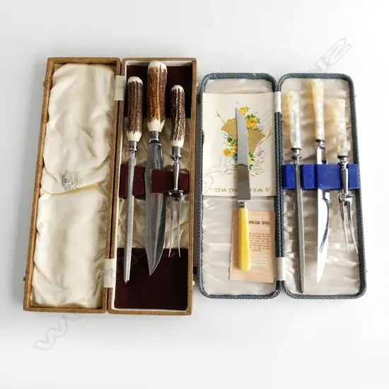 TWO BOXED SILVER PLATED CARVING SETS . ONE WITH DEER ANTLER GRIPS OTHER FAUZ MOP. L. ( BOX ) 400 & 350mm