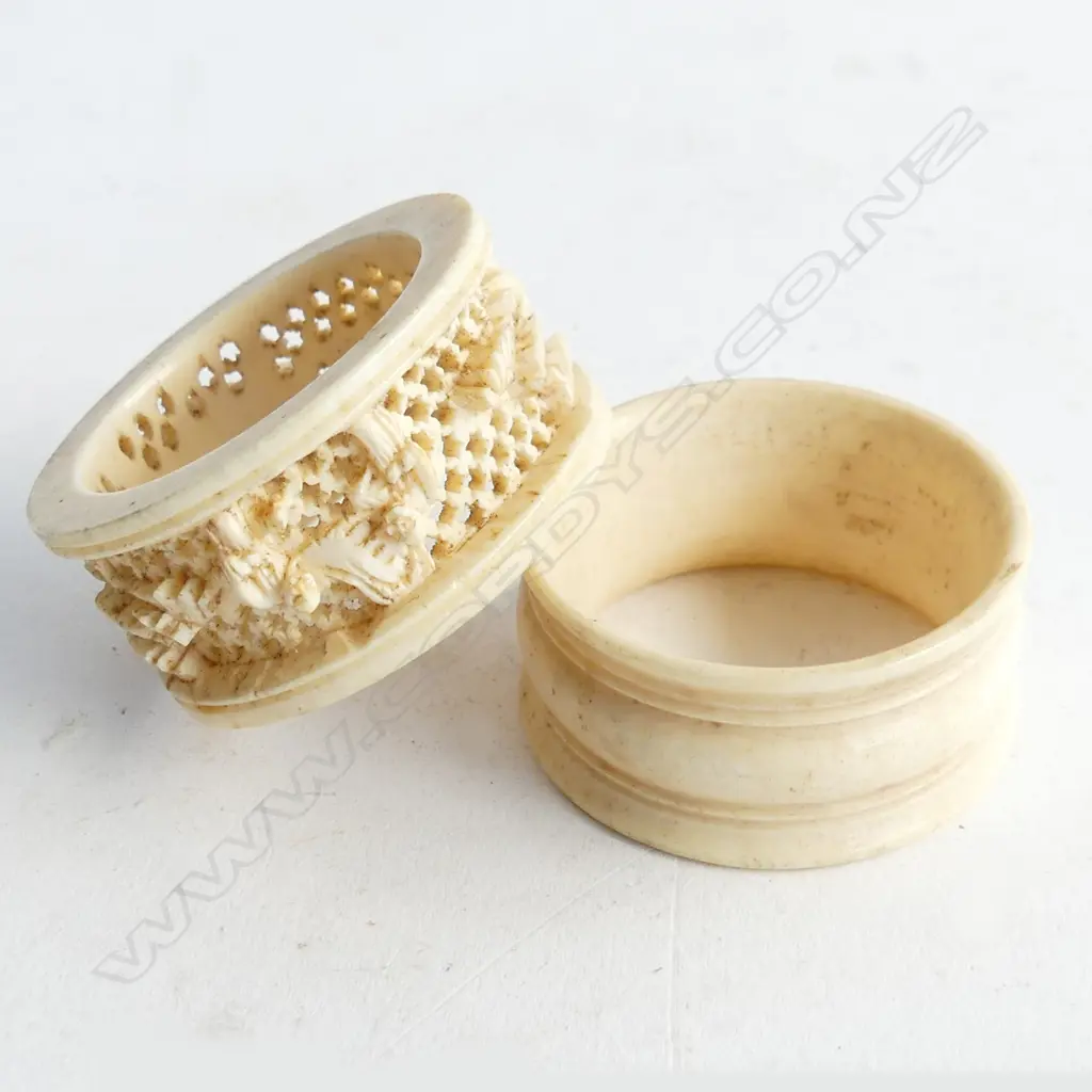 TWO NAPKIN RINGS, ONE CARVED IVORY & ONE BONE Image 1++