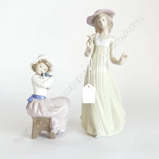 2 NAO FIGURINES; WOMAN w. FLOWER H.250mm, GIRL w. DOG H.170mm