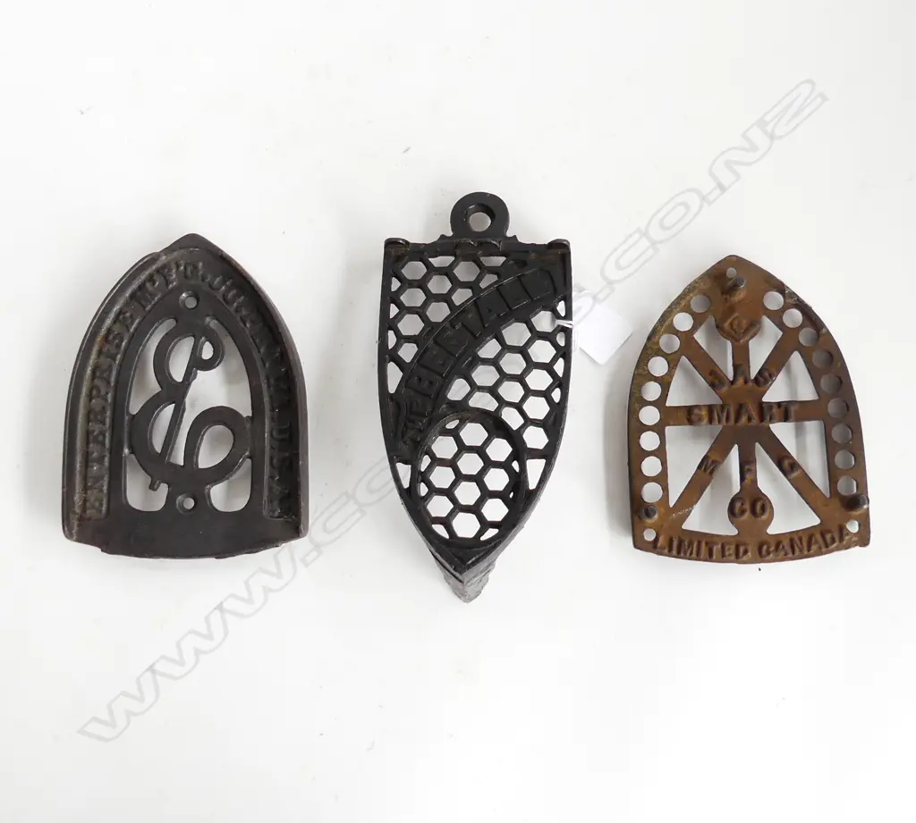 THREE VICTORIAN CAST IRON TRIVETS FOR IRONS – THE BEETALL, ENTERPRISE USA ETC. Image 1++