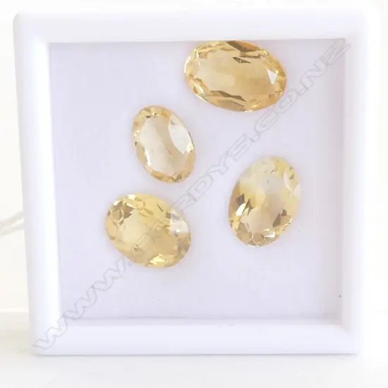 FOUR 10CT CITRINE OVAL STONES 