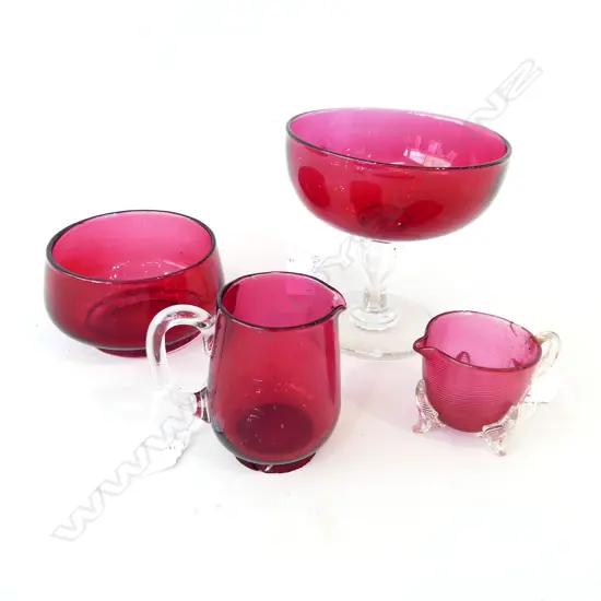 FOUR RUBY GLASS ITEMS. PARFAIT Dia 130mm TWO JUGS H.85mm & (FAULTED ) 55mm & BOWL Dia 110 H. 60mm 