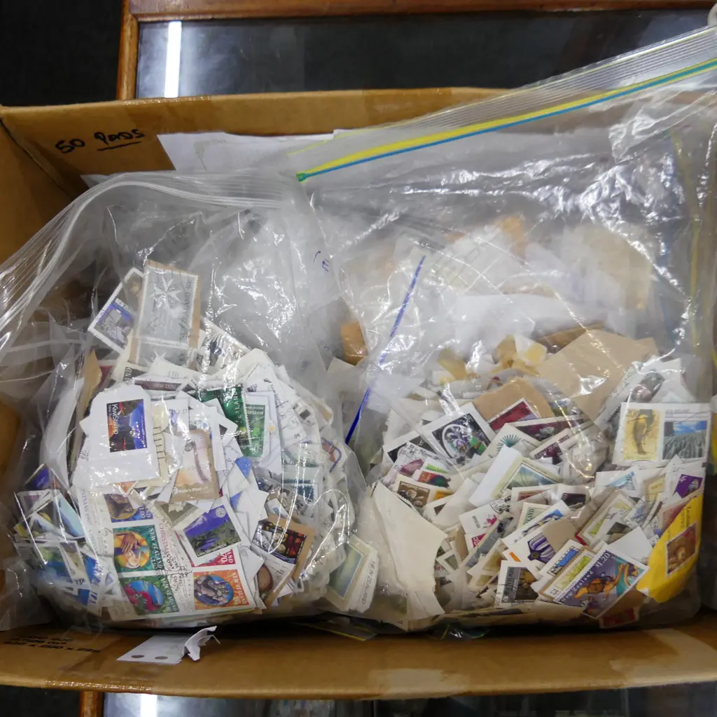 BIG BOX LOT STAMPS ON PAPER SORTED IN BAGS. 7 BAGS NZ, 3 AUST, 1 EACH GB, US ETC.. Image 1++