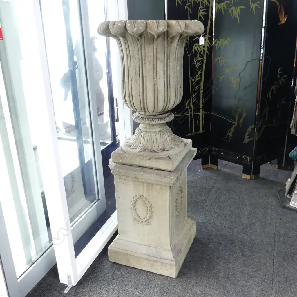 FLUTED CONCRETE URN H.690mm ON PLINTH. H.600mm.  (2 corners of plinth chipped) Image 1++