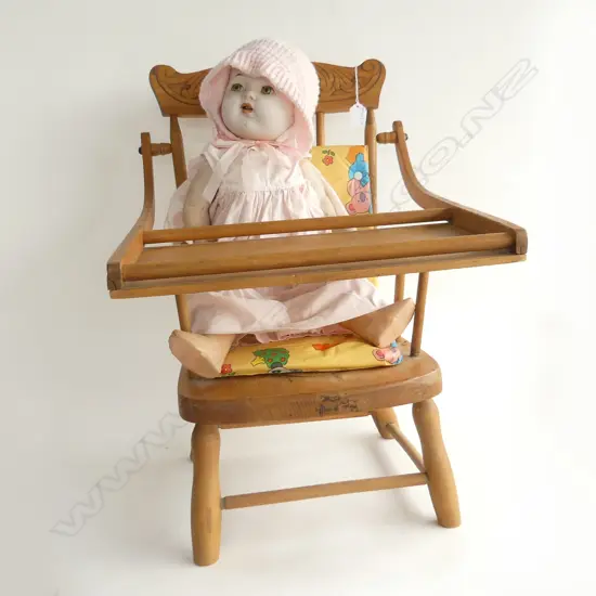 VINTAGE DOLL IN SPINDLE BACKED HIGHCHAIR