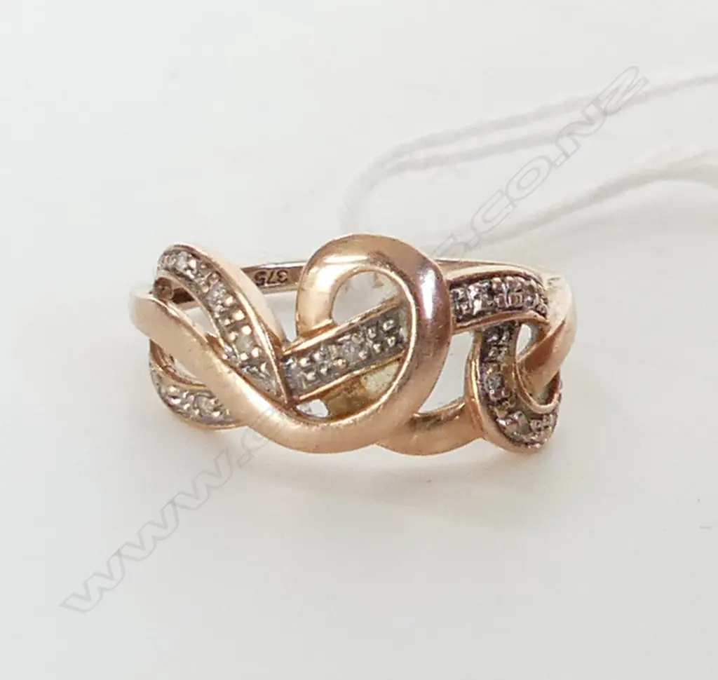 9CT GOLD RING SET WITH 11 SMALL DIAMONDS 2.20 GRAMS Image 1++