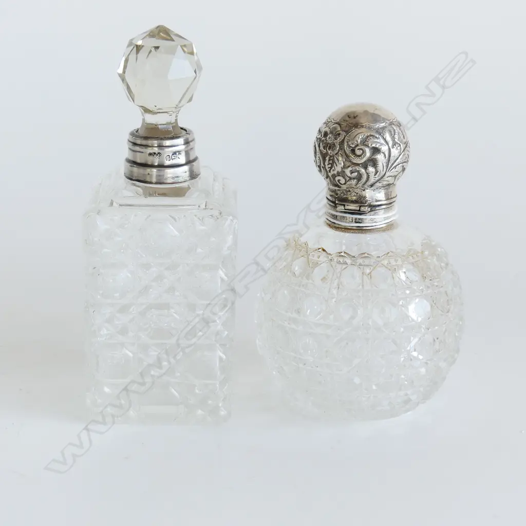 2 LG VINTAGE CUT GLASS SCENT BOTTLES, 1 WITH STG SILVER LID (H. 120mm) 1 WITH STG COLLAR & GLASS STOPPER (H.140mm) Image 1++