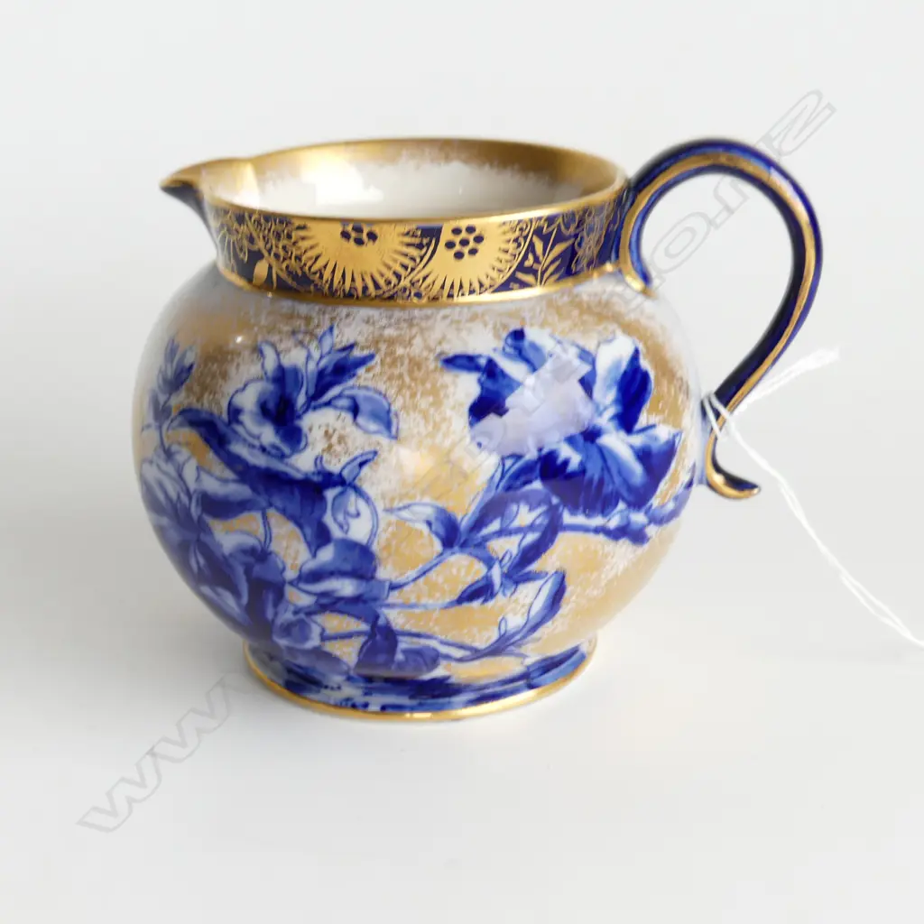 A late Victorian Doulton Burslem jug of squat spherical shape decorated in colours of blue Image 1++