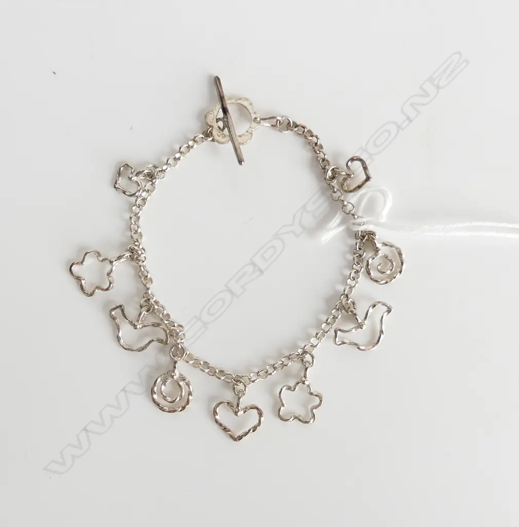 STG SILVER CHARM BRACELET, NINE CHARMS, 7.4GMS Image 1++
