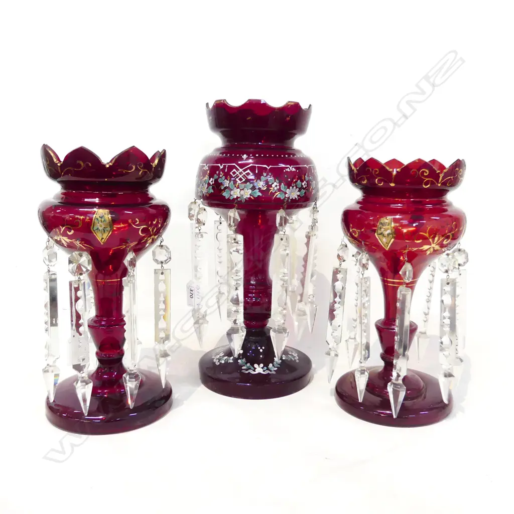 THREE VICTORIAN LUSTRE VASES. ALL RUBY COLORED ONE PAIR ( ONE LUSTRE BROKEN) AND ONE TALLER. TALLEST 365 PR 300mm HIGH. Image 1++