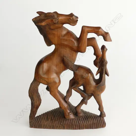 WOOD CARVING OF A HORSE AND FOAL.
