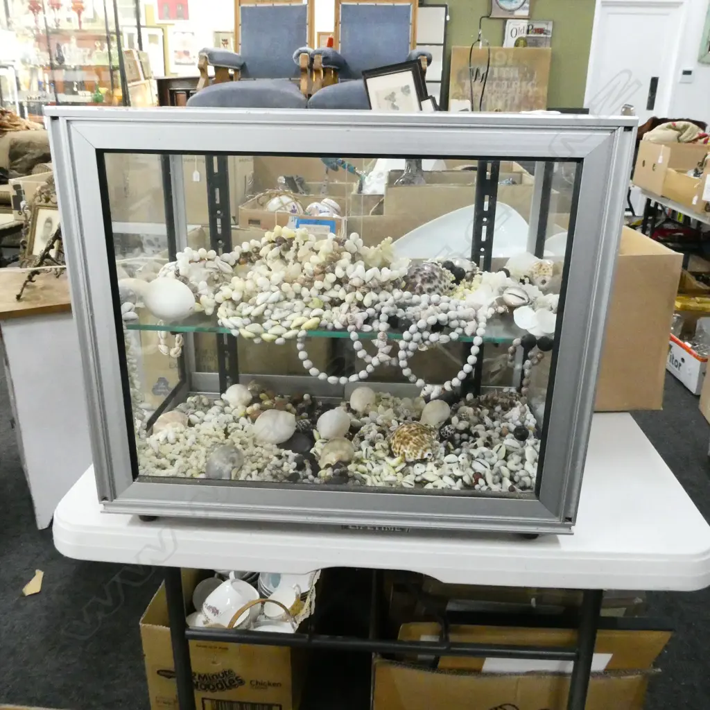 GLASS & ALUMINIUM DISPLAY CABINET, SLIDING DOORS, 2 SHELVES FULL OF ASST SHELL NECKLACES & SHELLS  500 X 310 X 400mm Image 1++