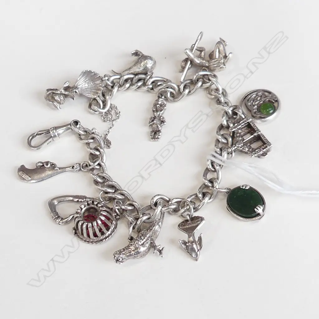 STG SILVER BRACELET w. ASST. NZ CHARMS 50.1 GRAMS Image 1++