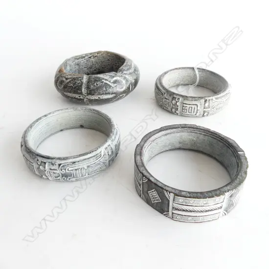4 CARVED STONE BANGLES 